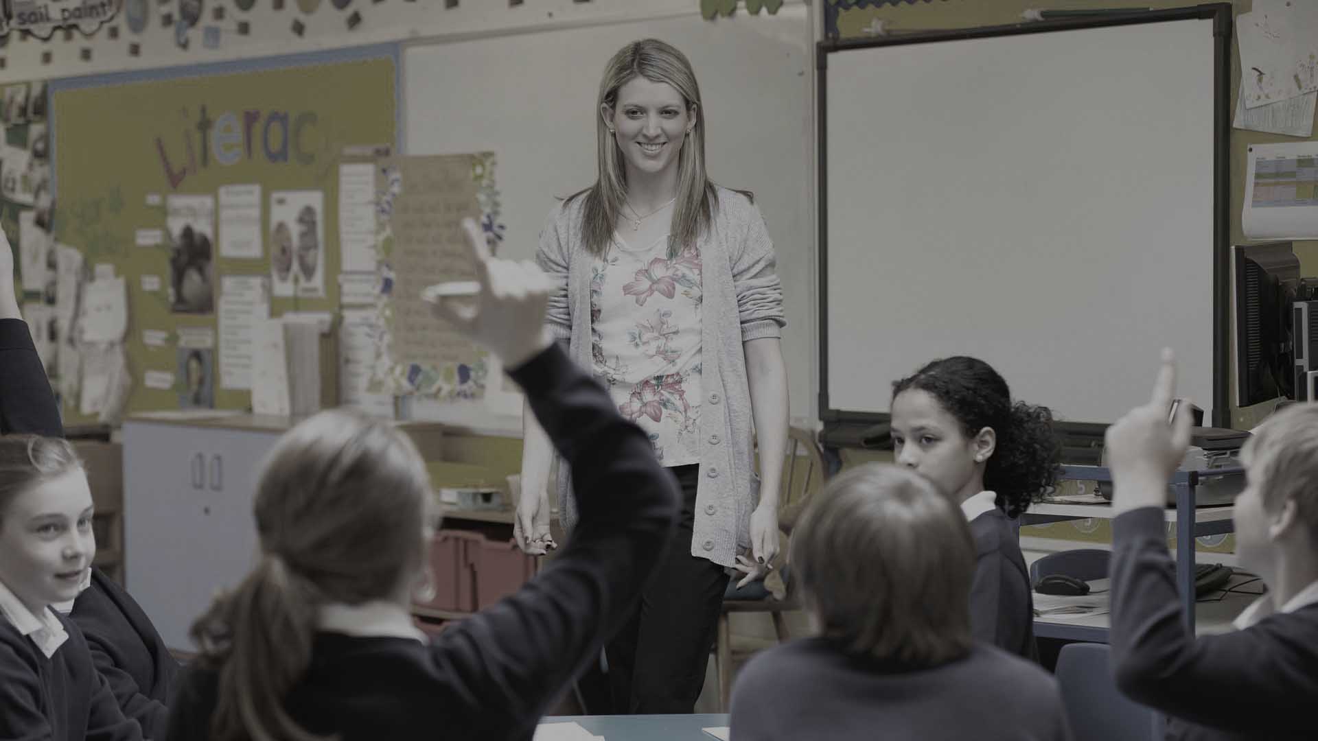 Teacher with pupils in classroom